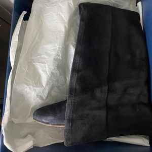 Over the knee suede boots with leather soles.